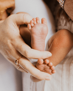 Abby providing hands-on infant feeding and lactation support
